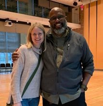 Photo of Heather smiling and posing with Director of Learning & Leadership Development at the time, James C. Horton