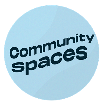 Light blue circle with text that flows up and to the right. Text reads: Community Spaces