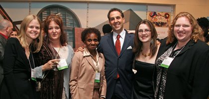 Photo of Heather smiling and posing with colleagues at the conference, including CEO at the time, Jonathan Herman, and Guild staff member Claire Wilmoth